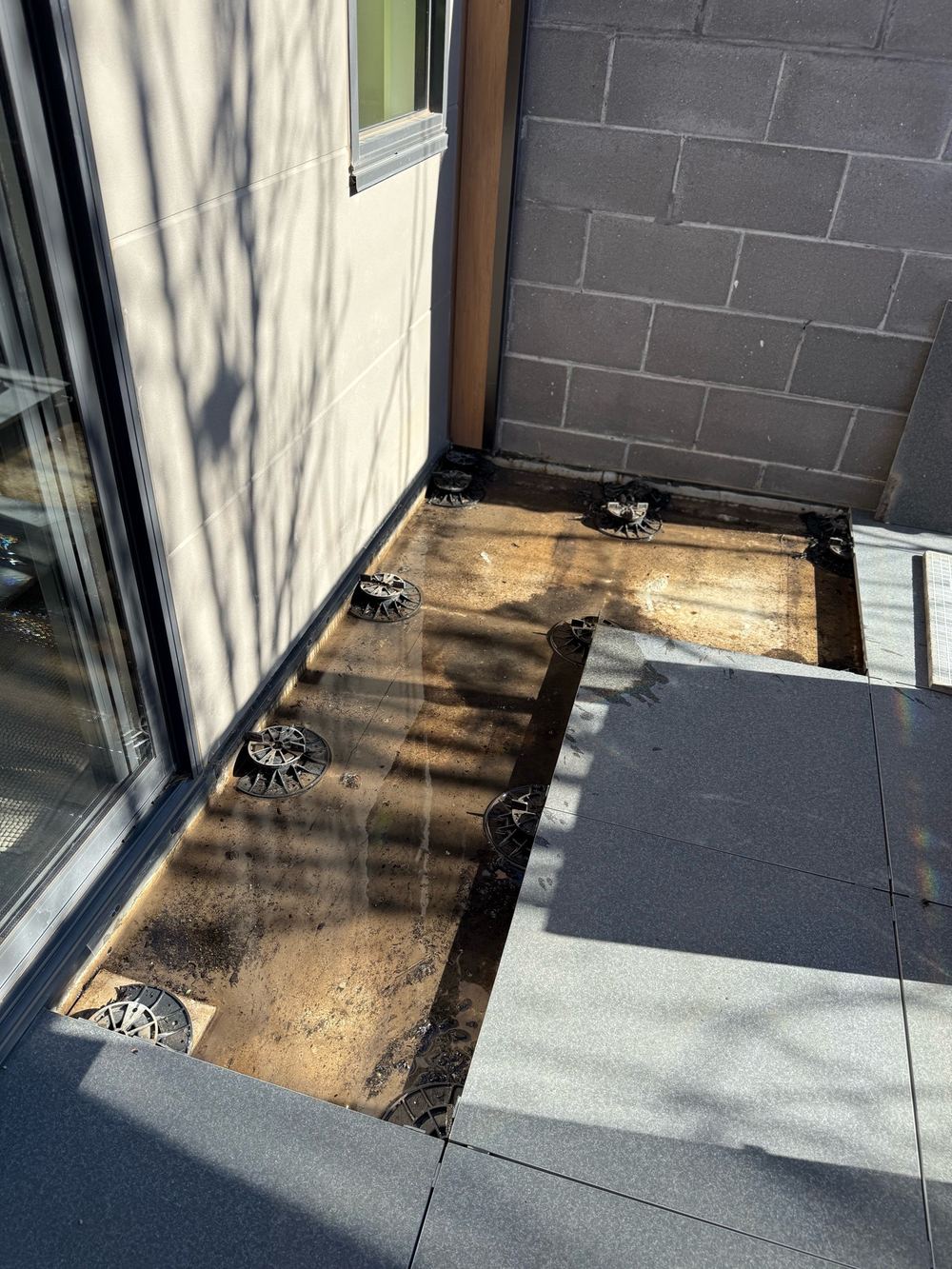 Balcony membrane flood tested once the pavers were lifted, found during a defect investigation in Bundoora