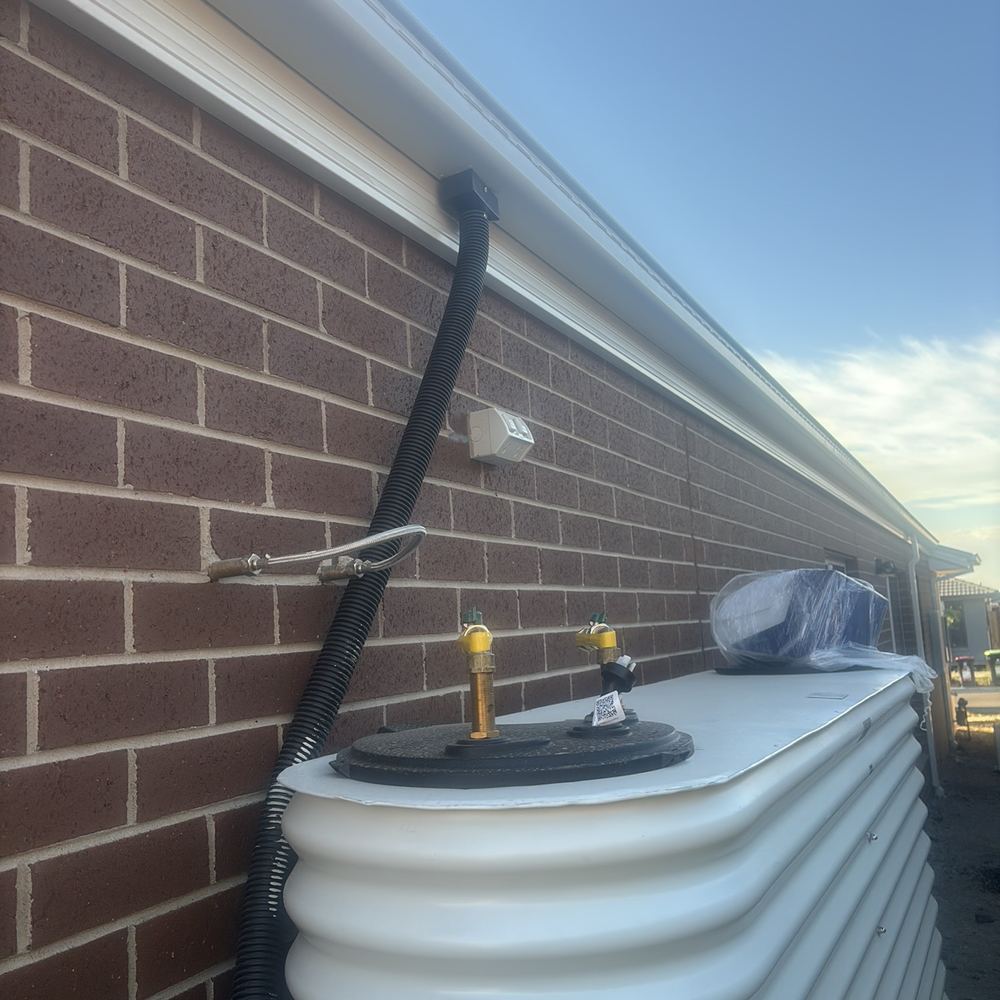 Downpipes still not installed with handover days away, found during a pre-handover inspection in Sunbury