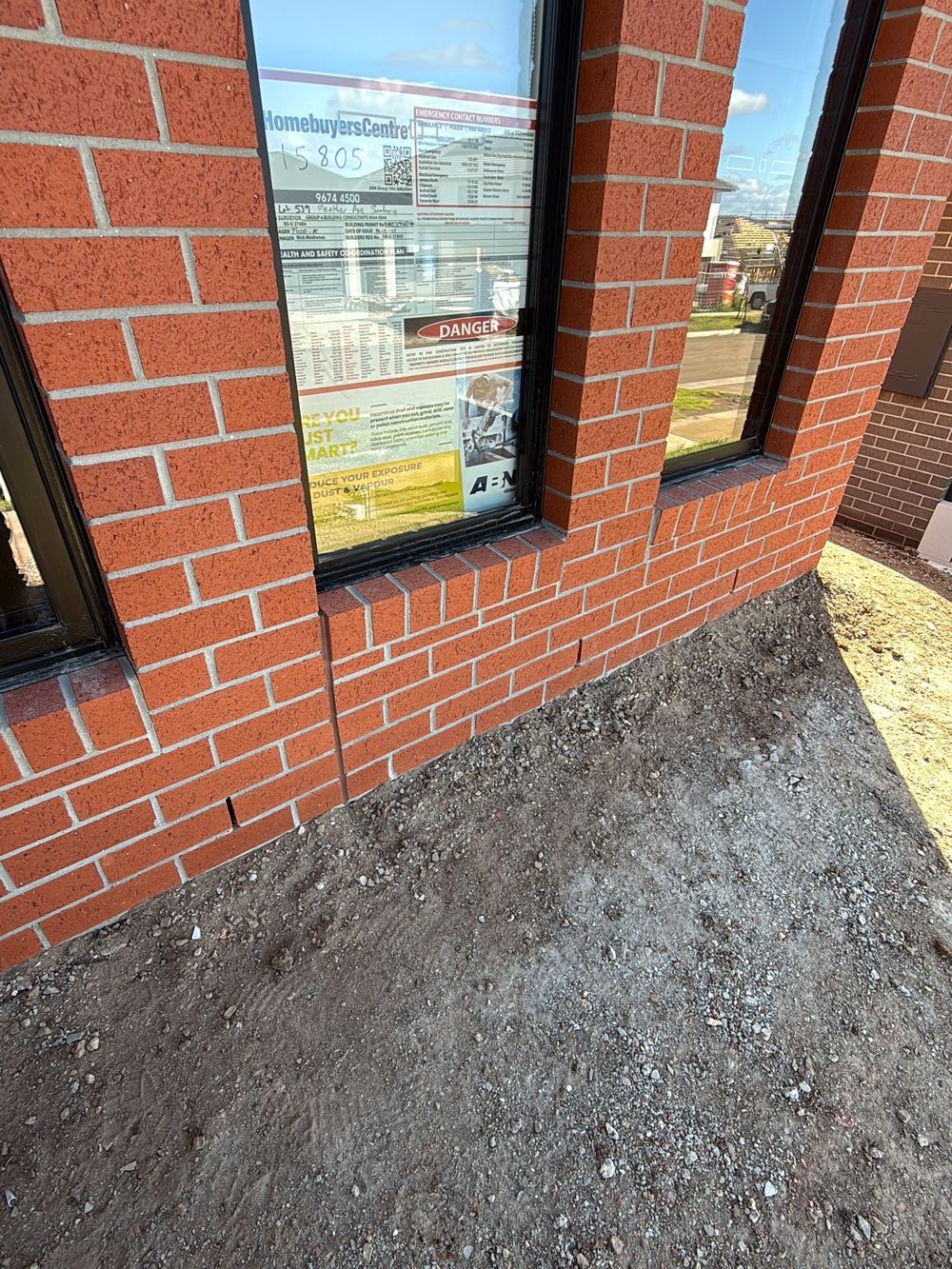 Weep holes clogged with mortar and render, found during a pre-handover inspection in Sunbury