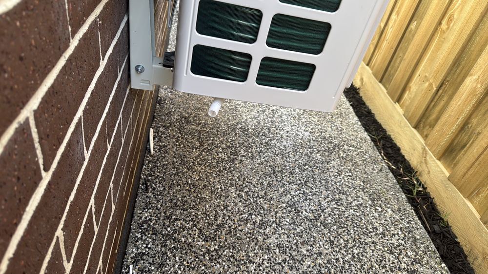 Damp ground beside the house where water is not draining away, found during a pre-purchase inspection in Wallan