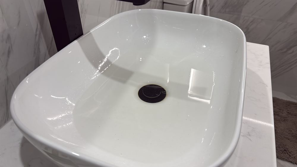 Basin draining slowly, pointing to a restriction in the waste, found during a pre-purchase inspection in Wallan