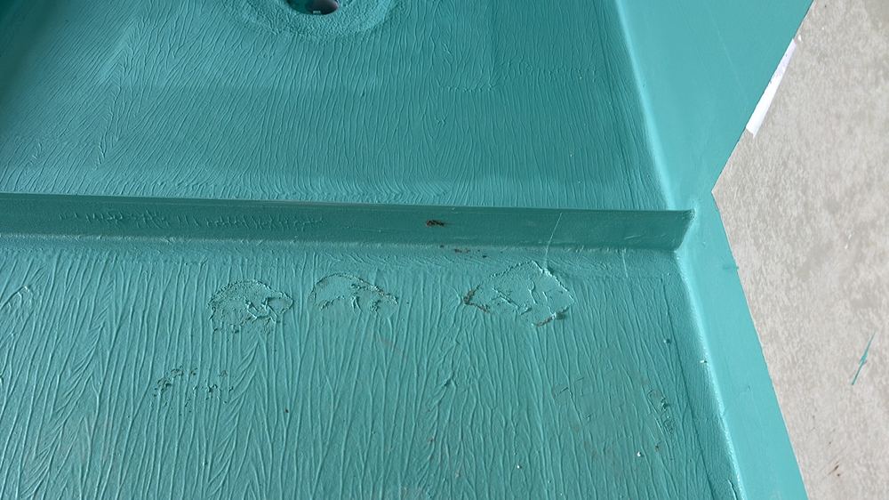 Membrane damaged at the floor junction and needing repair before tiling, found during a waterproofing inspection in Reservoir